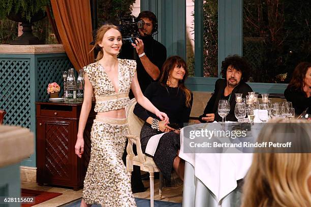 Lily-Rose Depp walks the runway in front of Caroline de Maigret and Yarol Poupaud during the "Chanel Collection des Metiers d'Art 2016/17 : Paris...