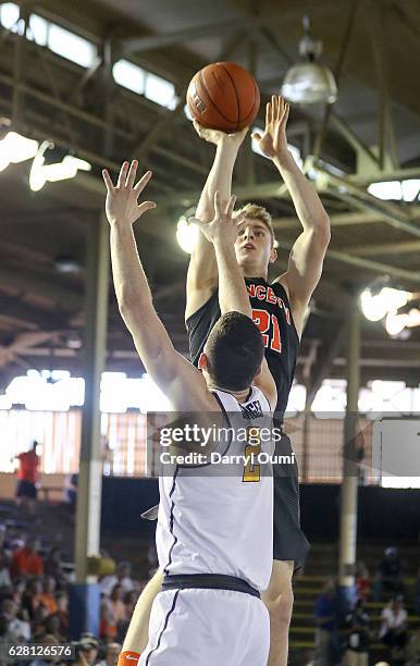 Henry Caruso of the Princeton Tigers shoots over Sam Singer of the California Golden Bears during the first half of the Pearl Harbor Invitational -...