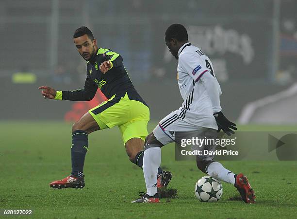Theo Walcott of Arsenal sees his pass blocked by Adama Traore of basel during the UEFA Champions League match between FC Basel and Arsenal at St....