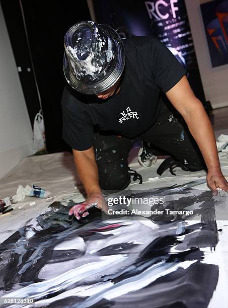 Artist Robert Vargas live paints at Lexus Presents Obras de Arte at MANA Garage on December 6, 2016 in Miami, Florida.