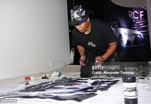 Artist Robert Vargas live paints at Lexus Presents Obras de Arte at MANA Garage on December 6, 2016 in Miami, Florida.