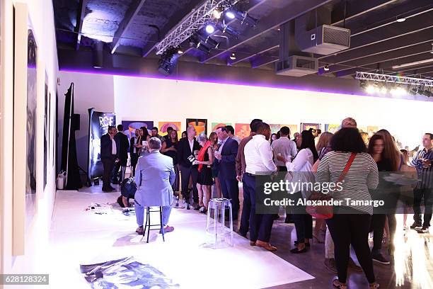 Artist Robert Vargas live paints at Lexus Presents Obras de Arte at MANA Garage on December 6, 2016 in Miami, Florida.