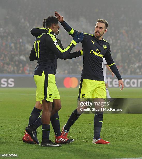 Alex Iwobi celebrates scoring the 4th Arsenal goal with Aaron Ramsey during the UEFA Champions League match between FC Basel and Arsenal at St....