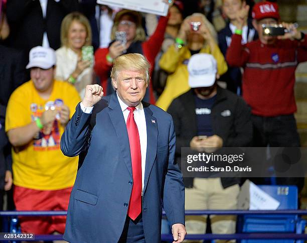 President-elect Donald Trump pumps his fist to cheers at Crown Coliseum on December 6, 2016 in Fayetteville, North Carolina. Trump took time off from...