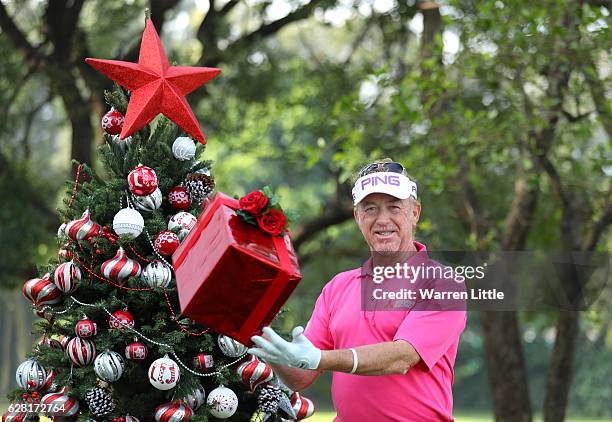 Miguel Angel Jimenez of Spain poses with a Christmas tree during the pro-am ahead of the UBS Hong Kong Open at The Hong Kong Golf Club on December 7,...