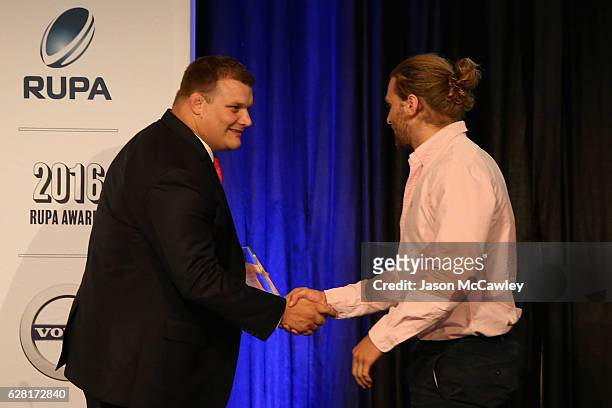 Lewis Holland accepts the Men's Sevens Player of the Year Award during the 2016 Rugby Union Players Association Awards Lunch at The Ivy on December...