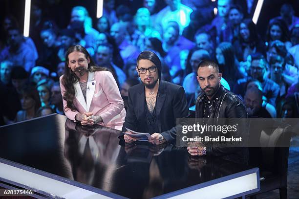 Host Dave Navarro flanked by judges Oliver Peck and Chris Nunez onstage during "Ink Master" Season 8 Live Finale at at Manhattan Center Grand...