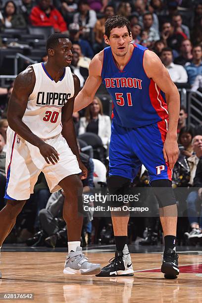Boban Marjanovic of the Detroit Pistons defends against Brandon Bass of the LA Clippers on November 7, 2016 at the STAPLES Center in Los Angeles,...