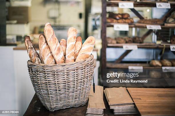 bread baguette in a bakery - french baguette stock-fotos und bilder