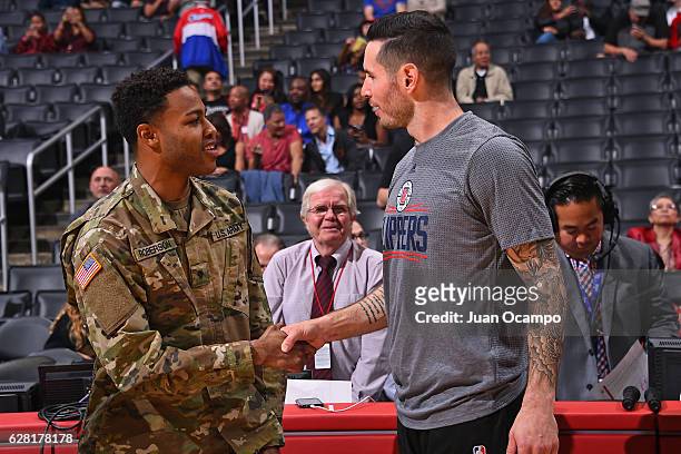 Redick of the LA Clippers greet a member of the U.S. Army before the game against the Detroit Pistons on November 7, 2016 at the STAPLES Center in...