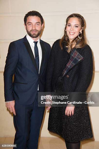 Guillaume Gouix and Alysson Paradis attend the "Chanel Collection des Metiers d'Art 2016/17 : Paris Cosmopolite" show on December 6, 2016 in Paris,...