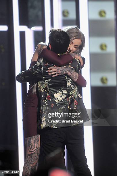 Season 8 winner of "Ink Master" Ryan Ashley and season 8 finalist Gian Karle react onstage during "Ink Master" Season 8 Live Finale at at Manhattan...