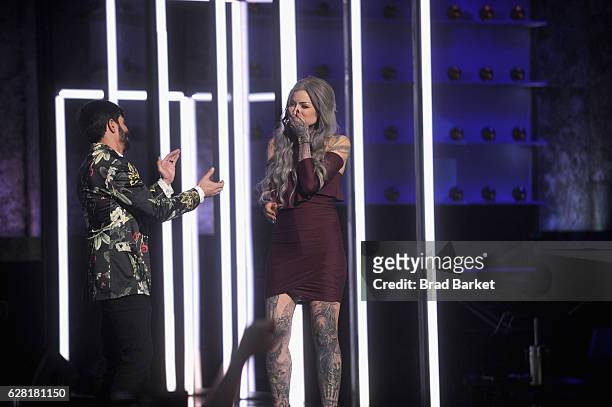 Season 8 winner of "Ink Master" Ryan Ashley and season 8 finalist Gian Karle react onstage during "Ink Master" Season 8 Live Finale at at Manhattan...