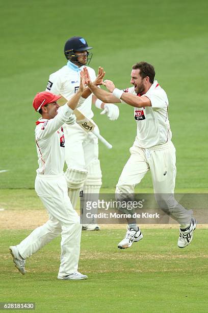 Chadd Sayers of the SA Redbacks celebrates after taking the wicket of Ryan Gibson of the NSW Blues during day three of the Sheffield Shield match...