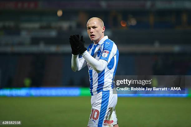 Aaron Mooy of Huddersfield Town applauds fans at full time during the Sky Bet Championship match between Huddersfield Town and Wigan Athletic at John...