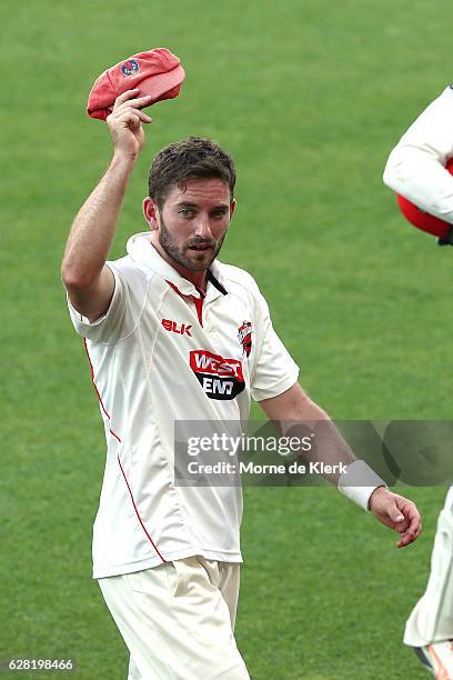 Chadd Sayers of the SA Redbacks raises his cap to the crowd after getting five wickets in the innings during day three of the Sheffield Shield match...