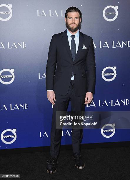 Actor Austin Stowell arrives at the Los Angeles Premiere "La La Land" at Mann Village Theatre on December 6, 2016 in Westwood, California.