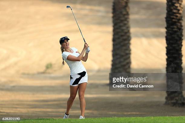 Paige Spiranac of the United States plays her second shot on the 14th hole during the first round of the 2016 Omega Dubai Ladies Masters on the...