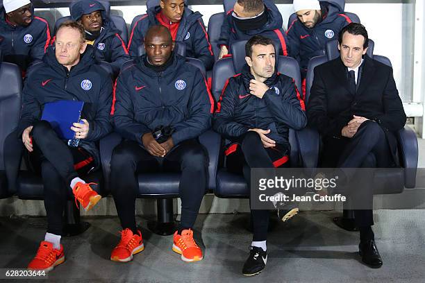 Coach of Goalkeepers for PSG Nicolas Dehon, assistant coaches of PSG Zoumana Camara and Juan-Carlos Carcedo, coach of PSG Unai Emery look on during...