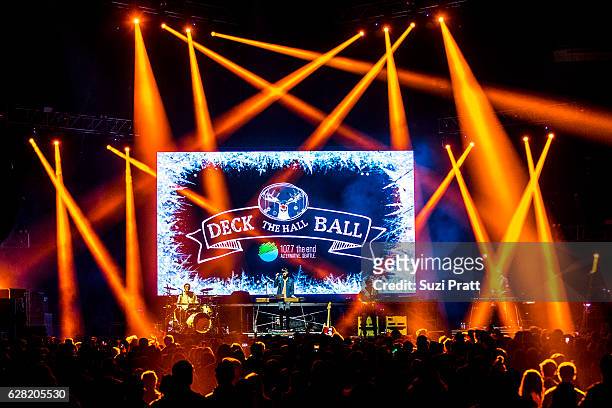 Ryan Winnen, Joe Memmel and Chase Lawrence of Coin perform at Deck the Hall Ball at KeyArena on December 6, 2016 in Seattle, Washington.