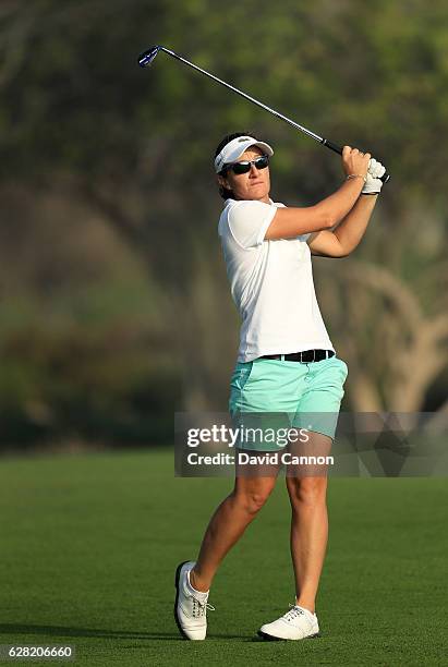 Gwladys Nocera of France plays her third shot on the tenth hole during the first round of the 2016 Omega Dubai Ladies Masters on the Majlis Course at...