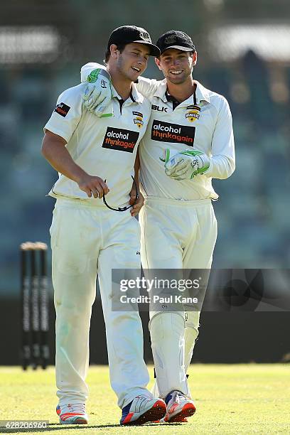 Hilton Cartwright and Sam Whiteman of Western Australia share a moment after a wicket during day three of the Sheffield Shield match between Western...