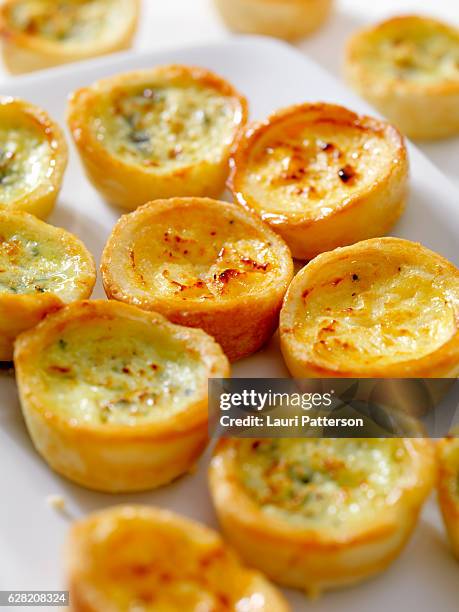 mini quiche lorraine and cheddar quiches - mini quiche stock pictures, royalty-free photos & images