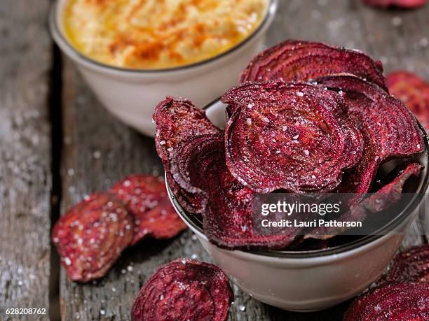 sea salted beet chips with a hummus dip - potato chips stock pictures, royalty-free photos & images