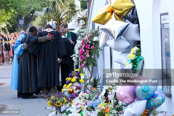 Charleston, SC Religious leaders from several churches around Charleston gather together to pray in the shadow of Emanuel AME Church.