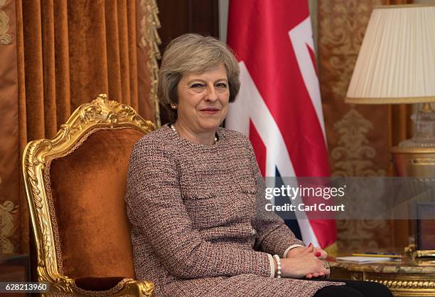 British Prime Minister Theresa May looks on as she meets Sheikh Tamim bin Hamad Al Thani, the Emir of Qatar, during a bilateral meeting at the Gulf...