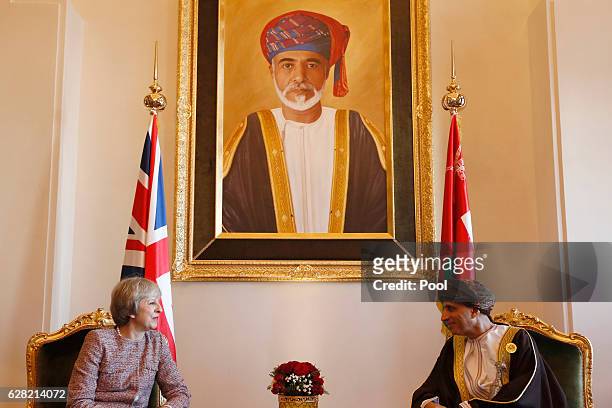Britain's Prime Minister Theresa May meets Oman's Deputy Prime Minister Fahad bin Mahmood at the Oman villa on December 7, 2016 in Manama, Bahrain.