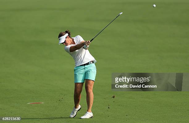 Gwladys Nocera of France plays her second shot on the 14th hole during the first round of the 2016 Omega Dubai Ladies Masters on the Majlis Course at...