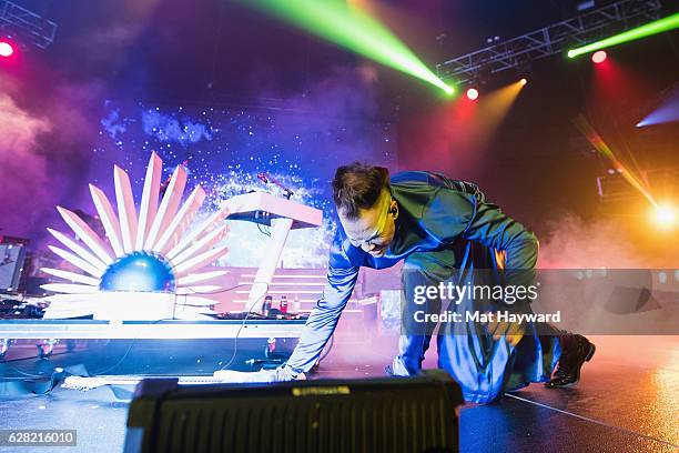 Luke Steele of Empire of the Sun smashes a guitar during Deck The Hall Ball hosted by 107.7 The End at KeyArena on December 6, 2016 in Seattle,...