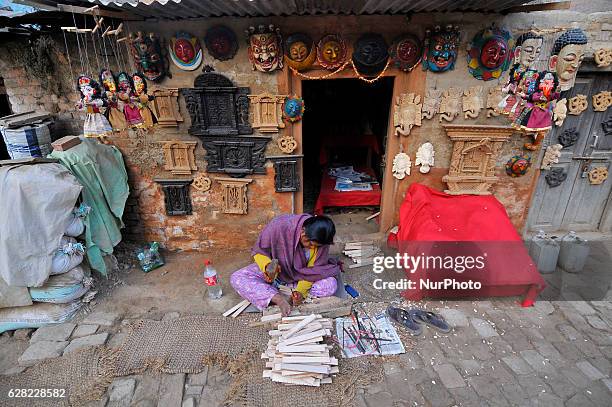 Yrs. Old, works on her carving business at Khokana, Patan, Nepal on Tuesday, December 06, 2016. Although her home was destroyed by last year's...