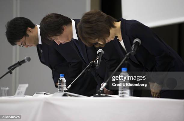 Isao Moriyasu, president and chief executive officer of DeNA Co., center, Tomoko Namba, founder and chairman, right, and Kenji Kobayashi, executive...