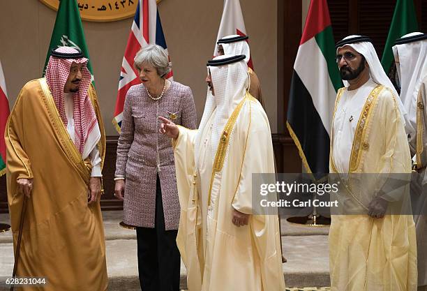 British Prime Minister, Theresa May, leaves with Gulf leaders after posing for a group photo on the second day of the Gulf Cooperation Council...