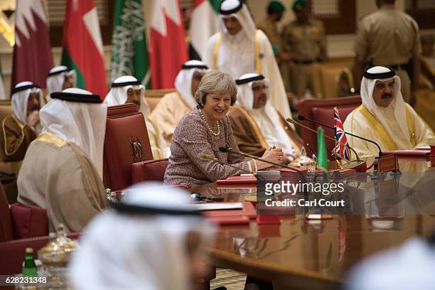 British Prime Minister, Theresa May, attends a plenary session on the second day of the Gulf Cooperation Council summit, on December 7, 2016 in...