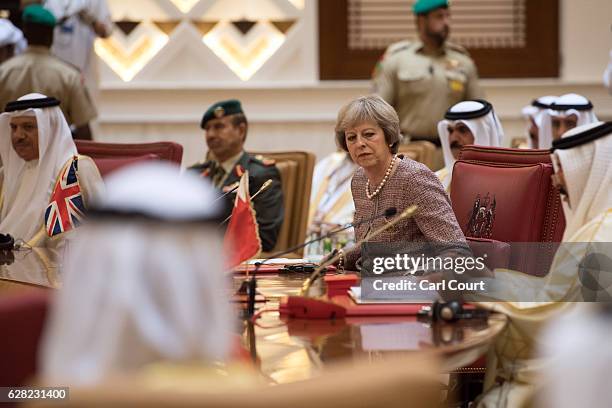 British Prime Minister, Theresa May, attends a plenary session on the second day of the Gulf Cooperation Council summit, on December 7, 2016 in...