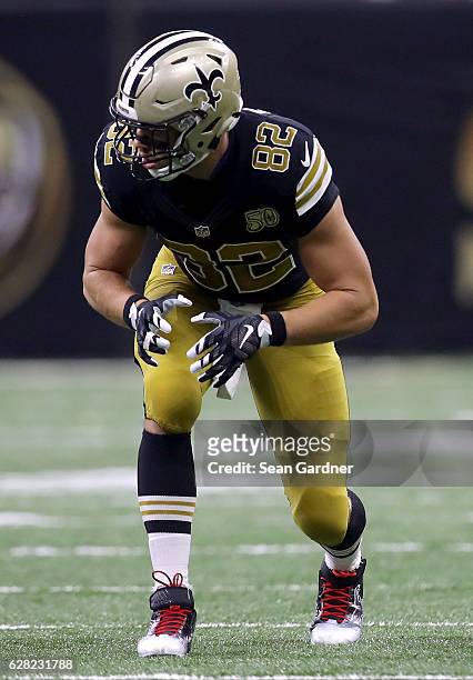 Coby Fleener of the New Orleans Saints stands at the line of scrimmage druing a game against the Detroit Lions at the Mercedes-Benz Superdome on...