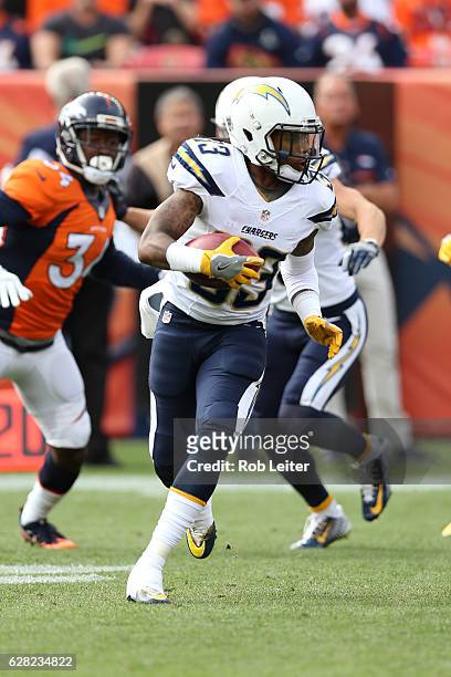 Dexter McCluster of the San Diego Chargers runs with the ball during the game against the Denver Broncos at Sports Authority Field At Mile High on...