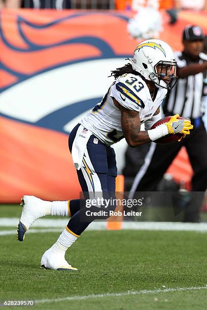 Dexter McCluster of the San Diego Chargers runs with the ball during the game against the Denver Broncos at Sports Authority Field At Mile High on...