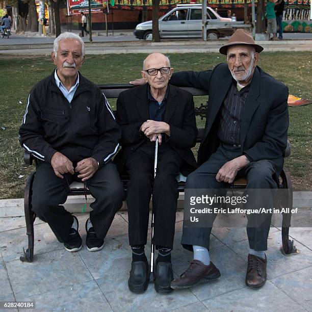 Old iranian men sit on a bench in a park, Lorestan Province, Khorramabad, Iran on October 11, 2016 in Khorramabad, Iran.