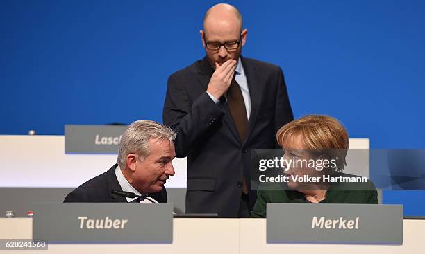 Chancellor and Chairwoman of the German Christian Democrats Angela Merkel speakes at the podium with the General Secretary Peter Tauber and the...