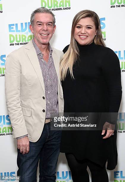 Elvis Duran poses with singer Kelly Clarkson at "The Elvis Duran Z100 Morning Show"on December 5, 2016 in New York City.