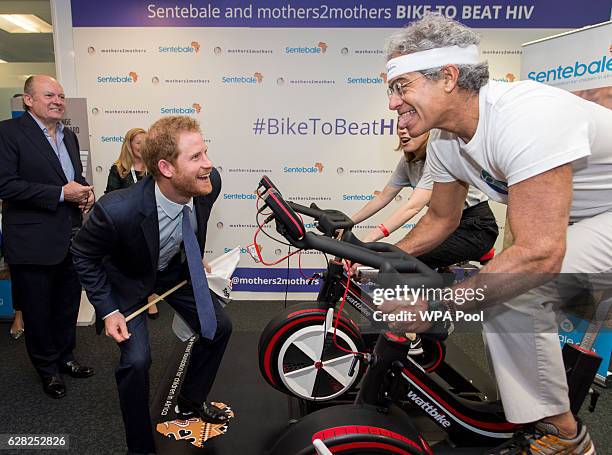 Prince Harry gives encouragement to Laura Main and 'Dr Mitch' during the Sentebale and Mothers2Be Cycle challenge 'Bike to Beat HIV' during an ICAP...