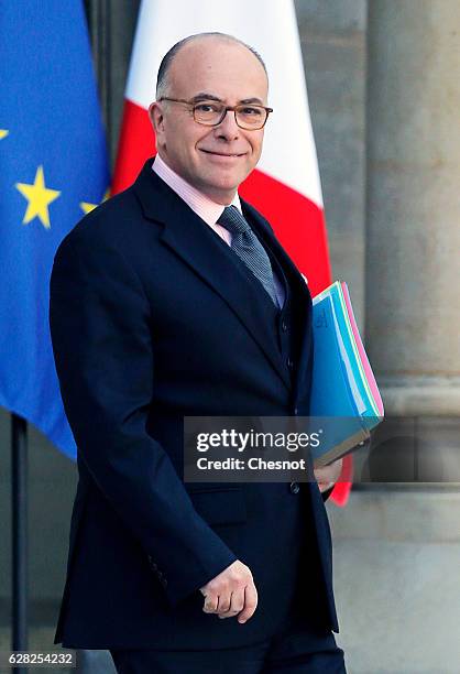 Newly appointed Prime Minister Bernard Cazeneuve leaves the Elysee Palace after the first cabinet meeting with the new government on December 7, 2016...