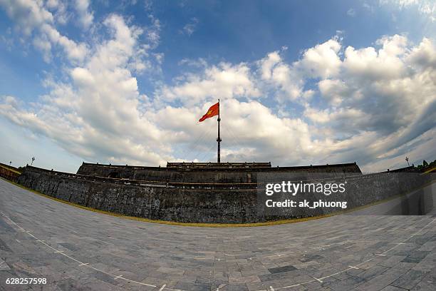 flag pole inside hue imperial central of vietnam - ancient roman flag stock-fotos und bilder