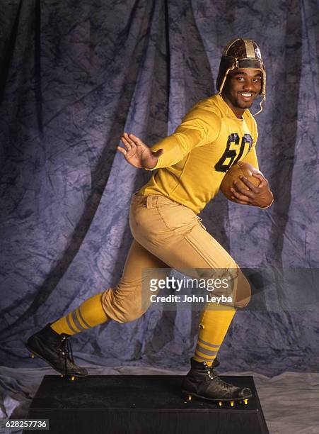 Rashaan Salaam poses in the Heisman stance during a photo shoot in 1994. He played college football for the University of Colorado and won the 1994...