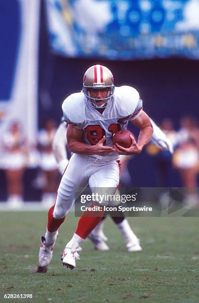 Wide receiver Ed McCaffrey of the San Francisco 49ers with a reception during the 49ers game versus the San Diego Chargers at Jack Murphy Stadium in...