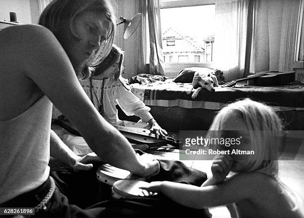 Young couple sits with their son and dog "Whippet" in their home circa 1970 in the neighborhood of Noe Valley in San Francisco, California.